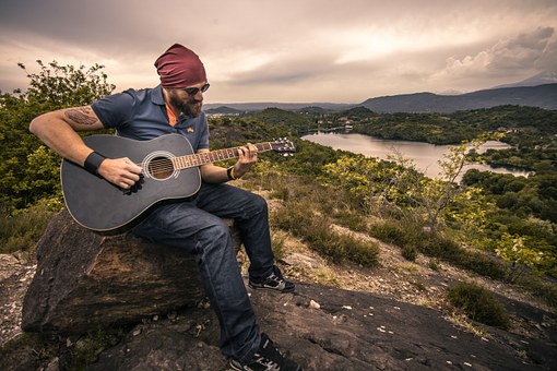 man playing guitar 